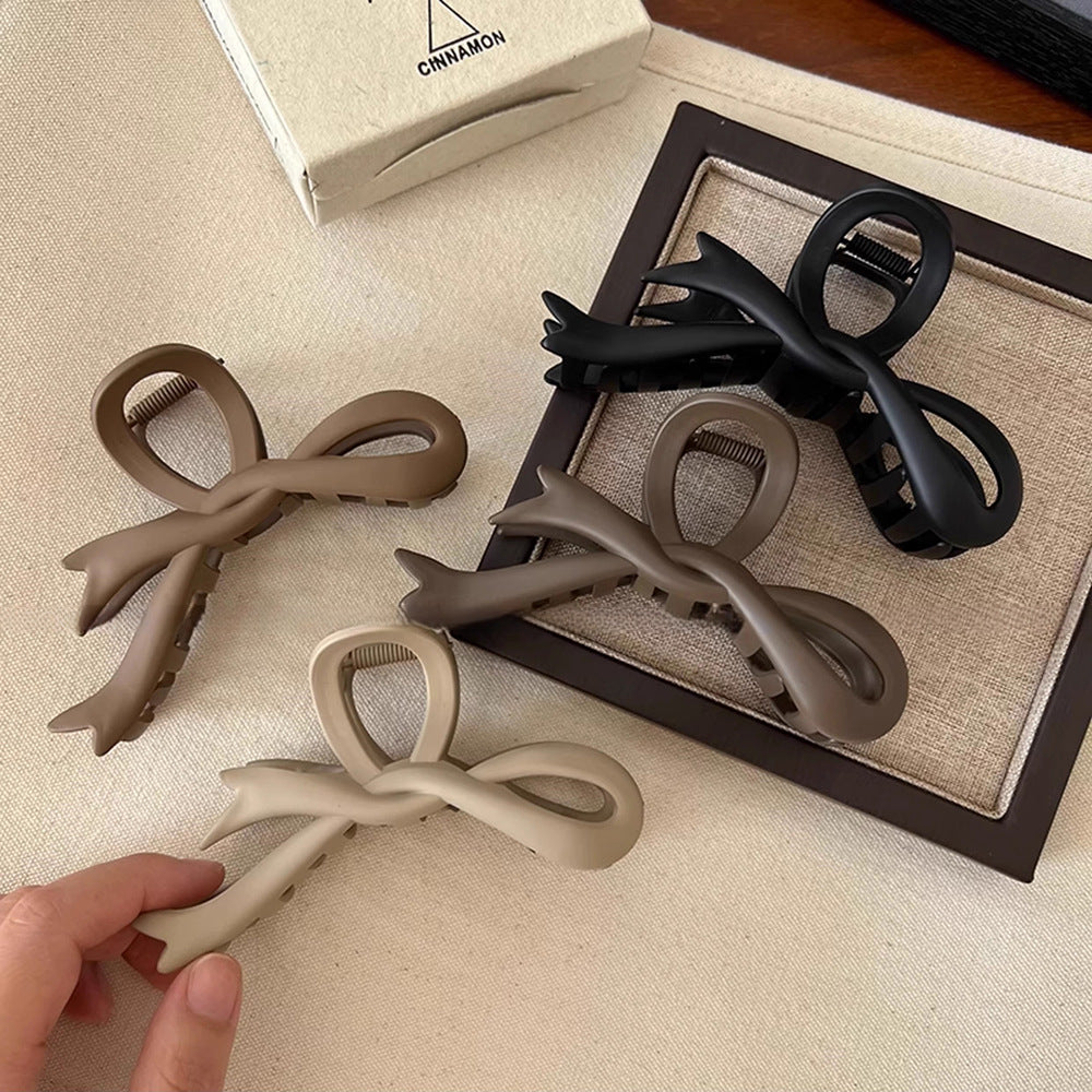 Women's Simple Style Bow Knot Arylic Hollow Out Hair Claws