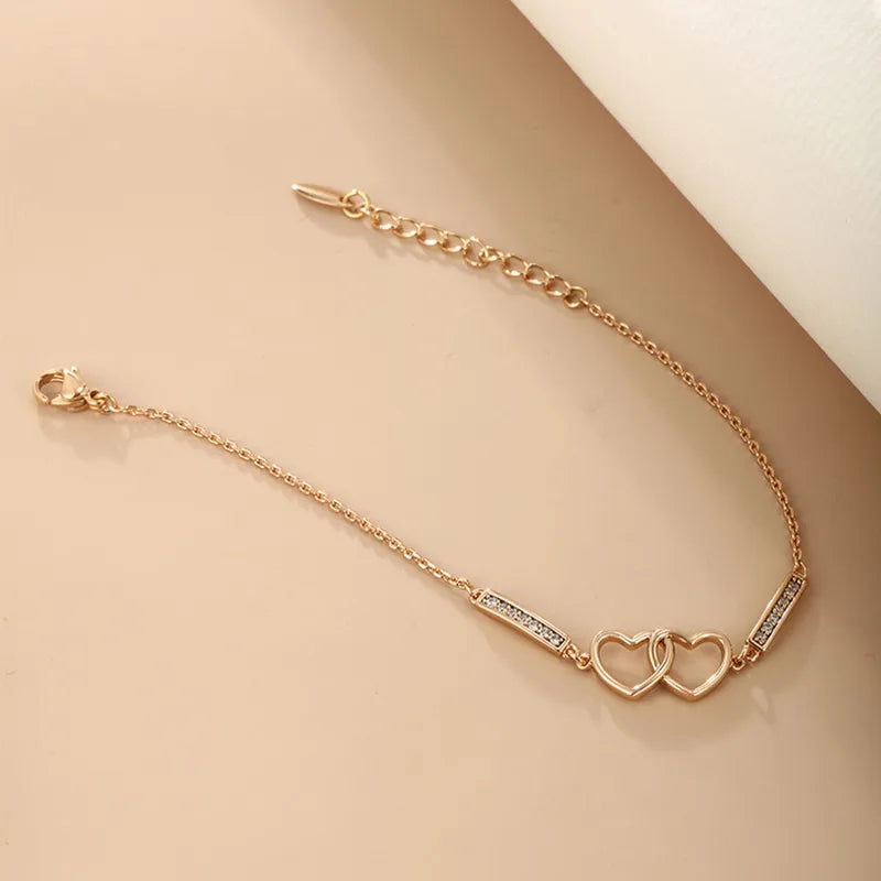 elegant xuping simple style heart shape alloy plating inlay artificial diamond 18k gold plated women's bracelets