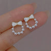1 pair elegant simple style streetwear flower bow knot plating inlay alloy artificial pearls zircon ear studs