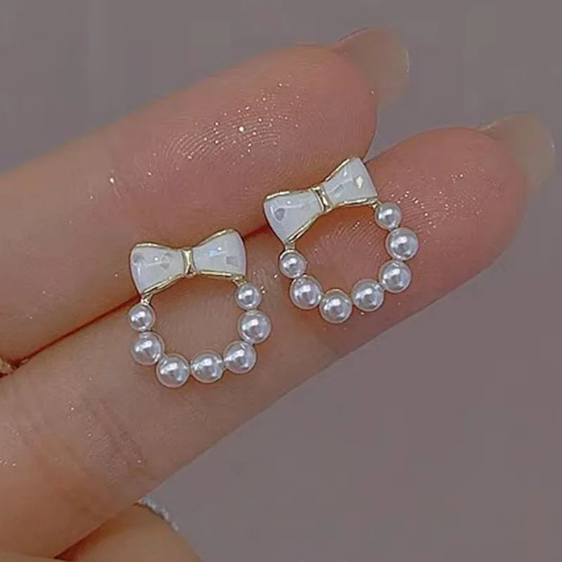 1 pair elegant simple style streetwear flower bow knot plating inlay alloy artificial pearls zircon ear studs