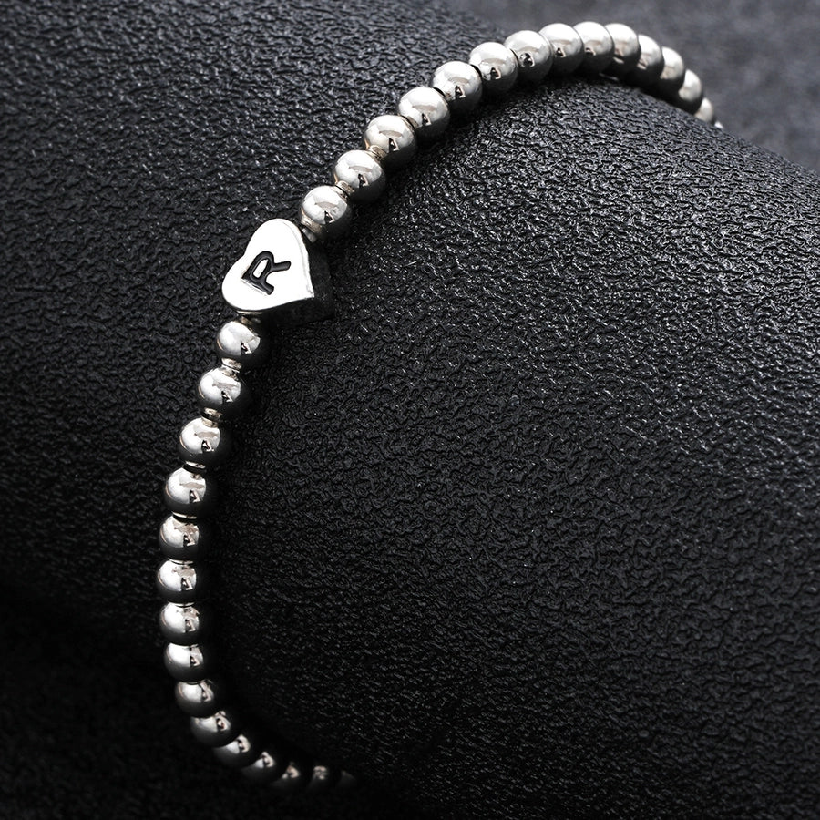 Europe and America Cross Border Hot Sale Creative 26 Letters round Beads Heart-Shaped Copper Bracelet Fashion Ins Simple Beaded Elastic Bracelet