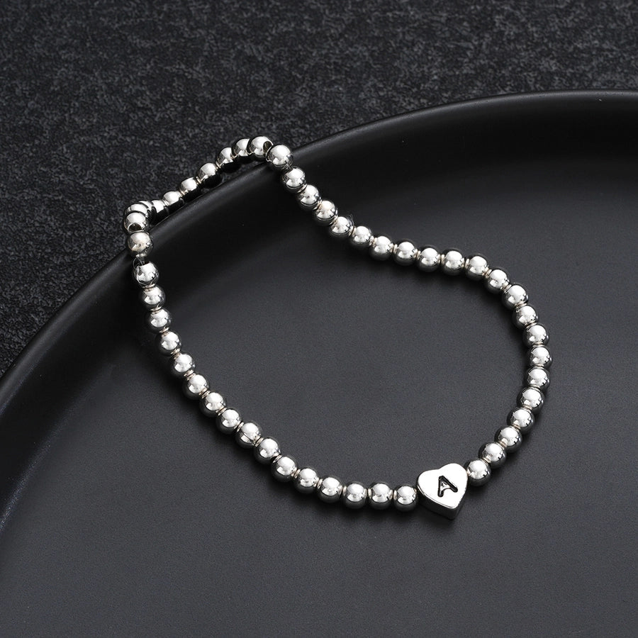 Europe and America Cross Border Hot Sale Creative 26 Letters round Beads Heart-Shaped Copper Bracelet Fashion Ins Simple Beaded Elastic Bracelet