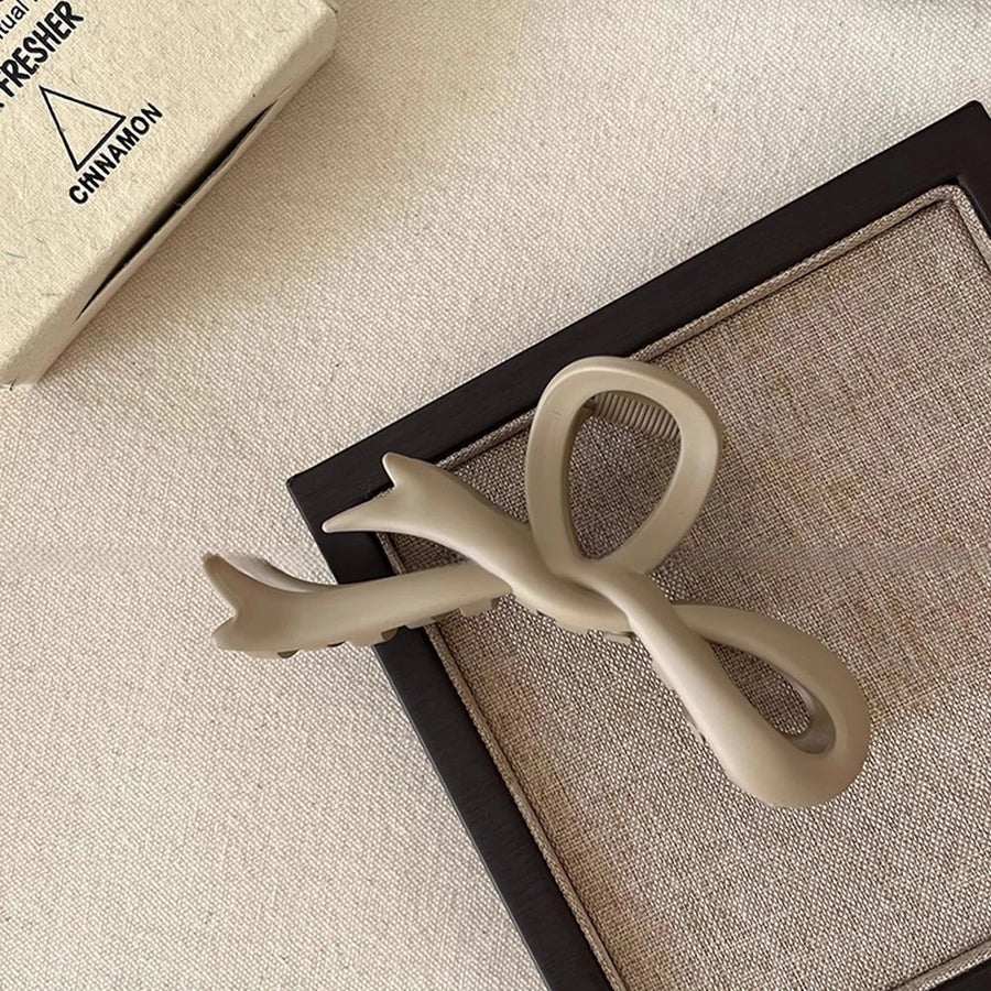 Women's Simple Style Bow Knot Arylic Hollow Out Hair Claws