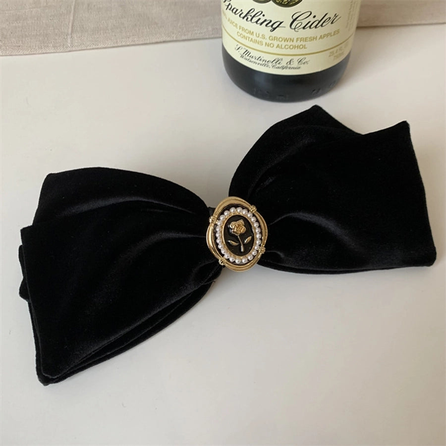 women's simple style flower alloy flannel bowknot artificial pearls hair clip