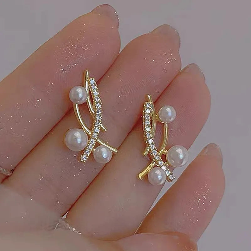 1 pair elegant simple style streetwear flower bow knot plating inlay alloy artificial pearls zircon ear studs