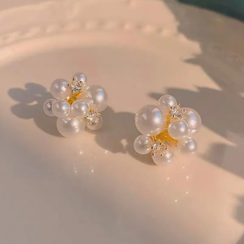 1 pair elegant simple style streetwear flower bow knot plating inlay alloy artificial pearls zircon ear studs