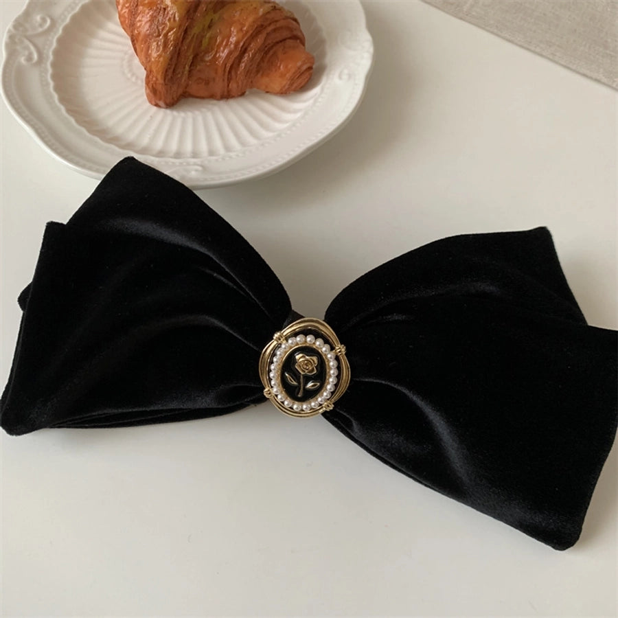 women's simple style flower alloy flannel bowknot artificial pearls hair clip