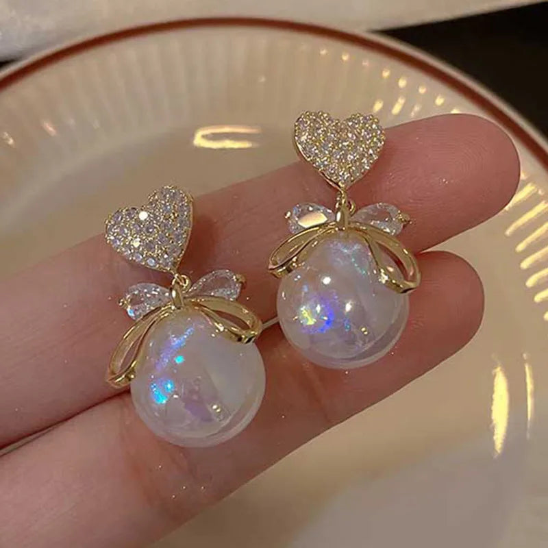 1 pair elegant simple style streetwear flower bow knot plating inlay alloy artificial pearls zircon ear studs