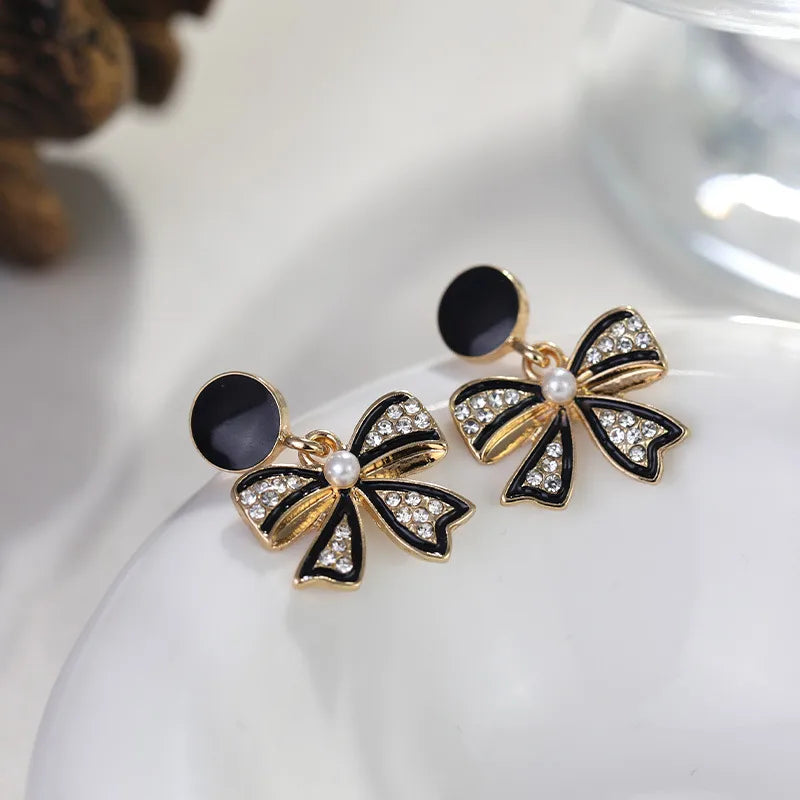1 Pair Simple Style Bow Knot Inlay Alloy Artificial Diamond Drop Earrings
