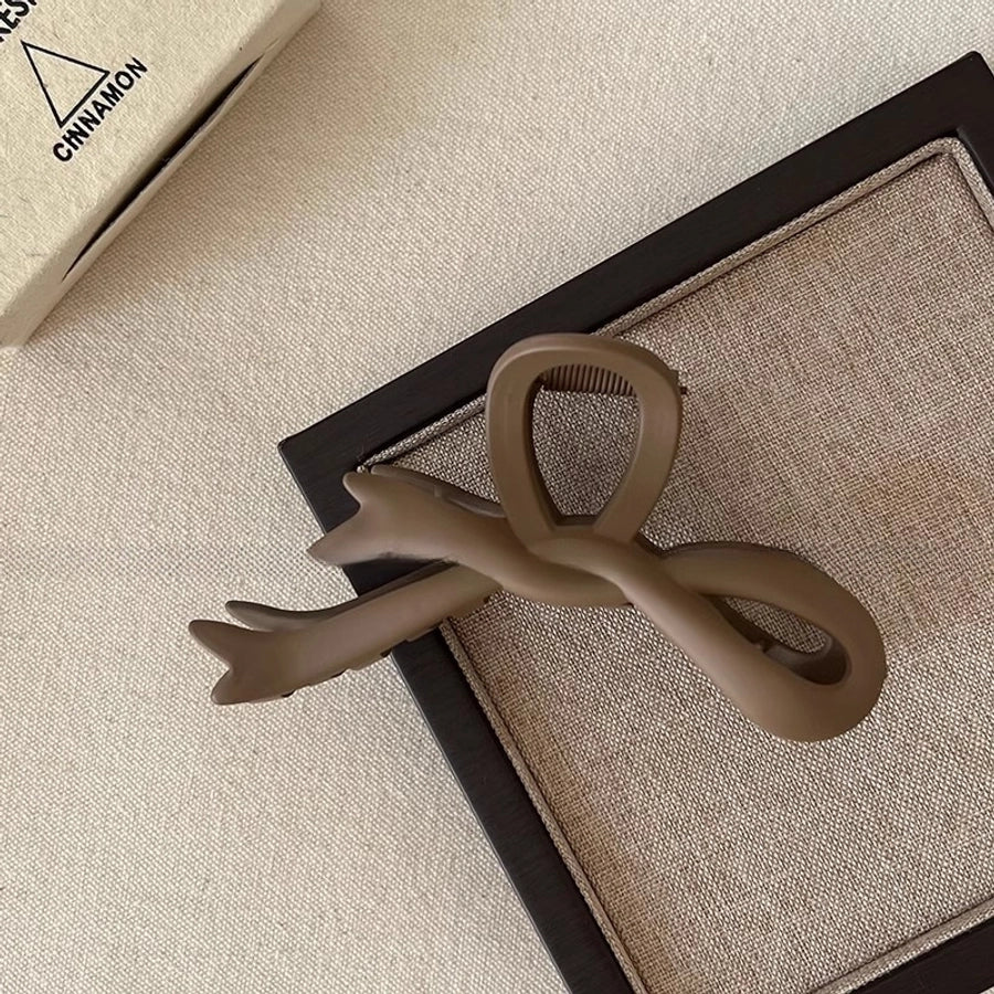 Women's Simple Style Bow Knot Arylic Hollow Out Hair Claws