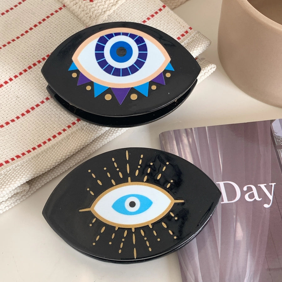 exaggerated funny devil's eye acetic acid sheets hair claws