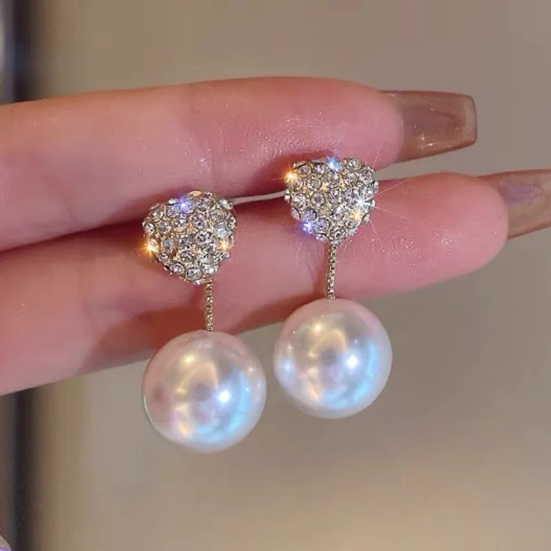 1 pair elegant simple style streetwear flower bow knot plating inlay alloy artificial pearls zircon ear studs