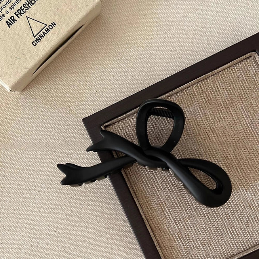 Women's Simple Style Bow Knot Arylic Hollow Out Hair Claws